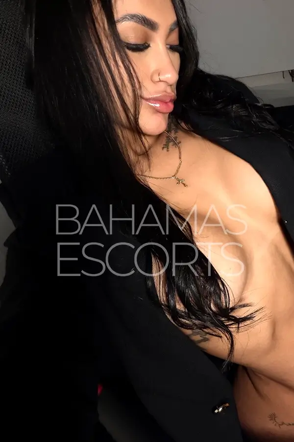 Attractive brunette relaxing in a modern penthouse with refined surroundings