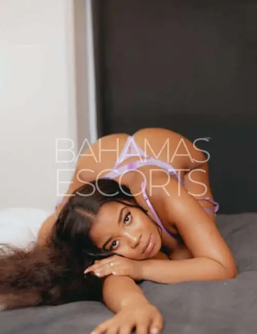 Confident woman in lingerie posing with a flirtatious smile