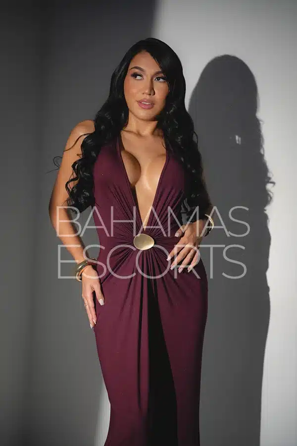 Elegant model showcasing sensual beauty in a sophisticated hotel suite